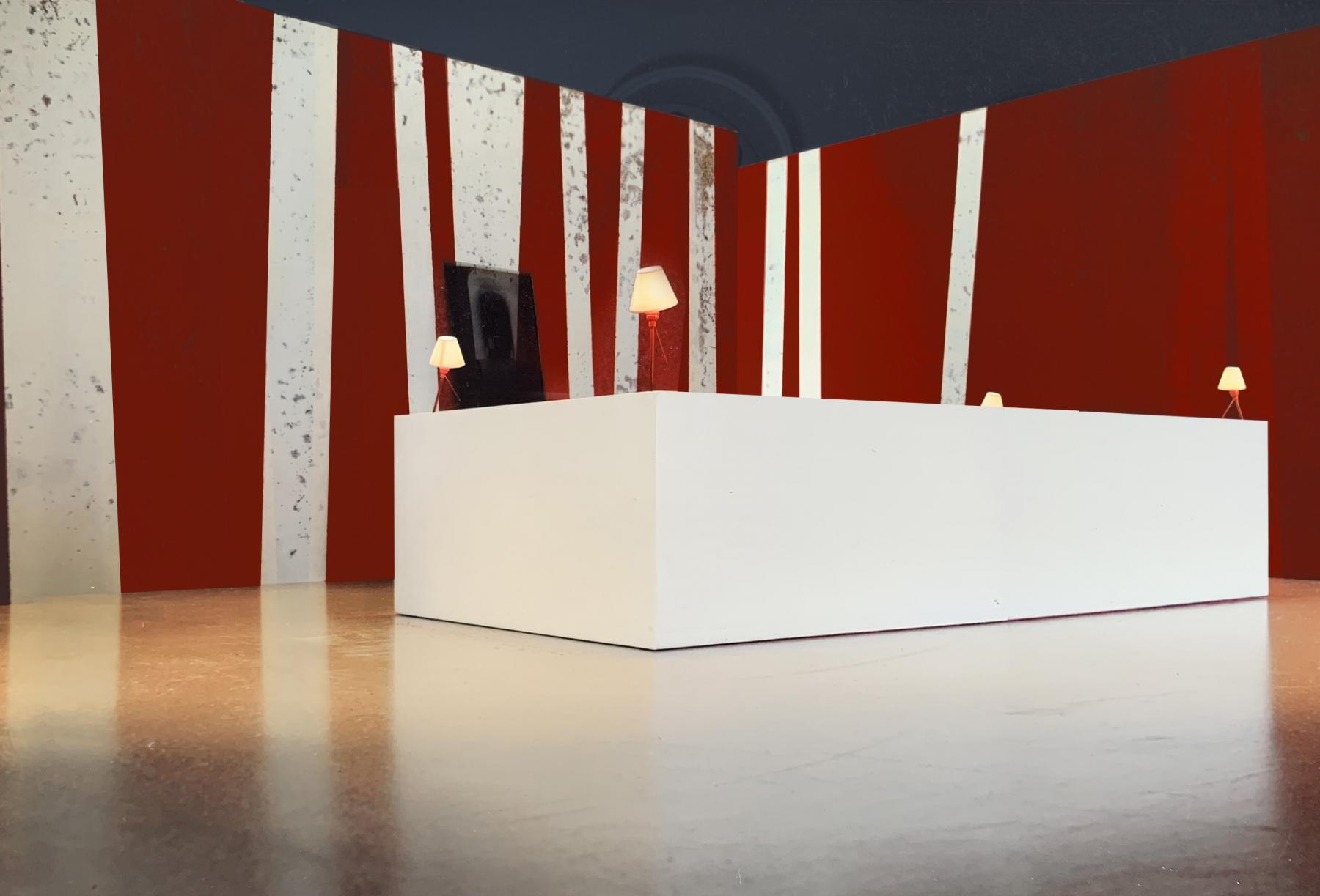2 canapés 3 places sont positionnés face à face et reliés par un tapis rouge. Ils peuvent see rapprocher pour former un salon fermé. Jérôme Barrier éditions.